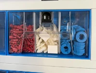 02_A transparent container divided into three identical compartments by metal dividers