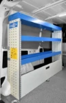 02_An enclosed floor compartment, configurable shelves and a full-length top shelf on the left of the Doblò