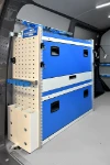 02_Syncro System shelves and cargo retaining accessories on the left of the first Transporter