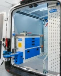 02_The work bench and fold-away vice bench on the left of the Transit