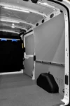 03_A bar with sliding fittings for cargo lashing accessories on the right of the Transit