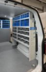 03_A complete wall of transparent drawers on the right of the Volkswagen Transporter owned by a coffee machine service