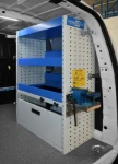 03_Shelves and a pull-out vice bench on the right of the Berlingo