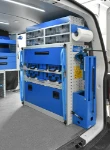 03_Syncro racking, a fold-away vice bench, cases and transparent containers on the right of the Transporter