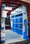 03_The drawers, transparent containers, enclosed compartments, shelves and vice bench on the right of the Man TGE