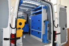 03_The right of the VW Crafter VW showing the fold-away vice bench and enclosed shelves