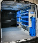 03_The shelves, transparent plastic containers and fold-away vice bench on the right of the Transporter
