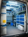 03_The transparent containers and wall-mounted ladder rack on the right of the MAN TGE