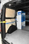03_The vice bench, transparent containers, shelves and drawers on the right of the Ford Custom