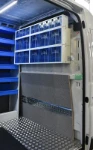 04_The bulkhead, reinforced at the bottom and with containers for spare parts at the top