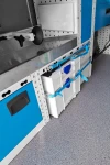 05_The Systainer3 trolley stowed in a floor-level compartment and secured with a lashing strap