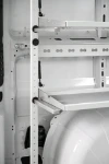 07_Close-up of fold-away shelves showing the side profile and stop pad and the rear rail with airline holes