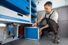 12_A floor-level, shuttle-type case compartment