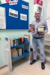18_Syncro’s Luca Comunello makes a donation to Cassola’s Book Crossing project