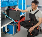 20_A case compartment with a bar and strap retaining system