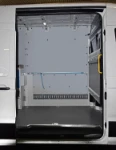 A cargo strap on a wall liner in the VW Crafter