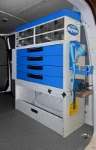 A fire extinguisher holder and a Syncro System pull-out vice bench in the Transporter