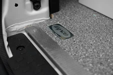 A liner with protective edging in stainless steel