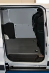 A marble-look plywood floor liner and sheet steel bodywork liners in a Ford Connect