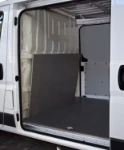 A marble-look plywood bulkhead liner in the Fiat Ducato