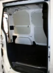 A non-slip plywood floor liner and steel sheet interior liners
