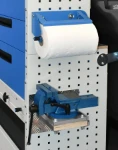 A paper roll holder over a vice bench