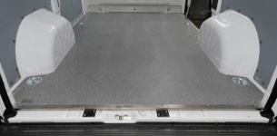 A resin-coated marine floor liner in a van