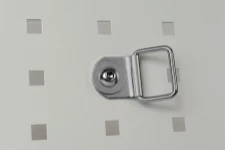 A ring attached to the side or racking