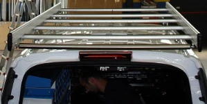 A roof rack with a loading roller and side fences on a Connect