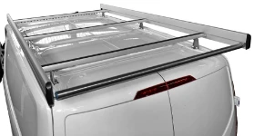 A roof rack with cross-bars, side fences and a loading roller on a Custom