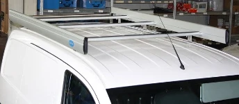 A roof rack with rear roller and side fences on an NV200