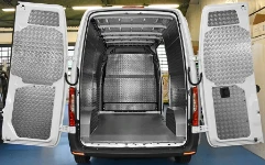 A Sprinter with a marble-look plywood floor liner and aluminium chequer plate interior liners