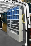 A van fitted with shelving and drawer units with transparent drawers