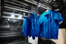 A van with clothing on hanging garment bars
