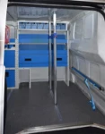 A vertical cargo bar in the van load area