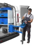 A vice on a fold-away bench in a van