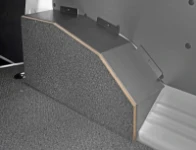 A wheel arch liner in steel and marine-grade plywood