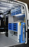 A work bench and compressor-generator combo on the right of the MAN TGE
