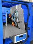 Bulkhead lining with drawer and straps for securing signs in the Talento