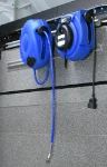 Cable and hose reels installed on the bodywork