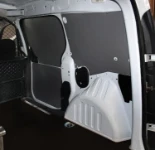 Cargo lashing systems along the wall of a van used to inspect liquid metering systems