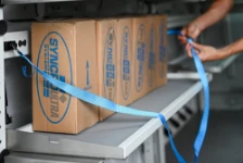 Cargo strapped in place on fold-way shelves