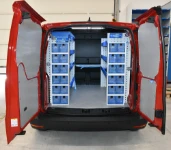 Fit-out with shelving and transparent drawers in the VW Caddy