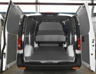 Floor and bulkhead liners in marble-look plywood and steel sheet bodywork liners in the Vito