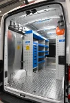 Hooks on the wall and shelving in the Transit with shelves and drawers