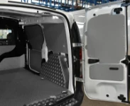Left-side lining of the Dokker with chequer-plate aluminium wheel arch cover