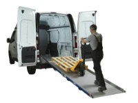 Loading a pallet with a pallet truck up the ramp into the van