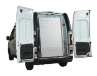 Loading ramp folded and stowed vertically in the cargo area