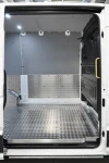 MAN TGE cargo area seen from the rear doors, with aluminium lining