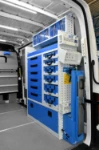 Metal cases, drawers, accessories and a fold-away vice bench on the right of the VW Crafter